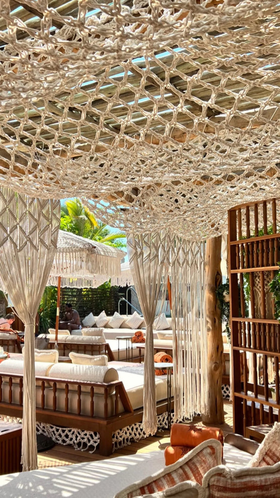 Handwoven macramé parasol adding bohemian elegance to outdoor spaces