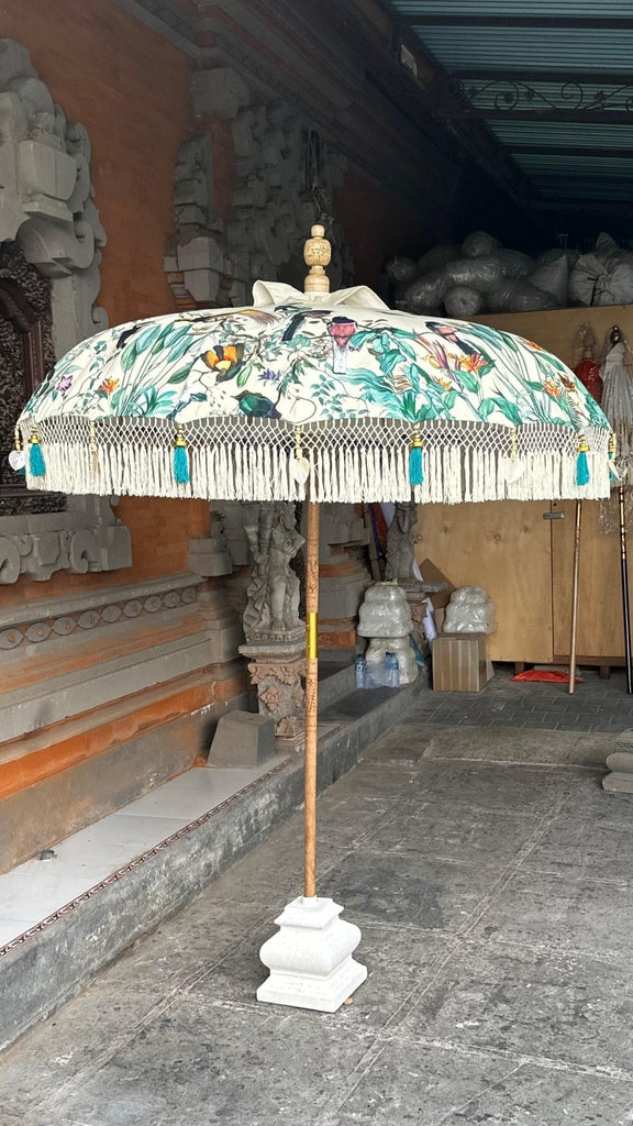 Elegant Birdie Parasol with colorful birds and greenery design, perfect for stylish outdoor settings.