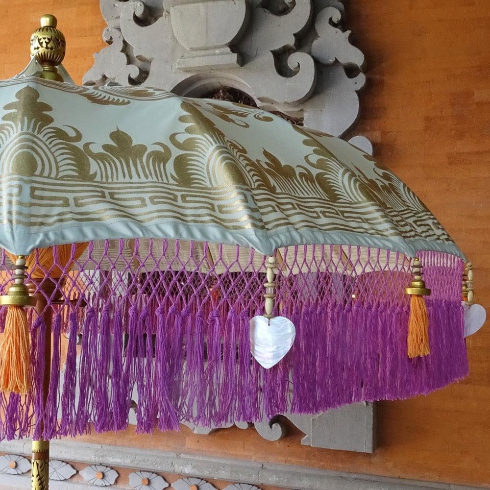 Stylish Beige and Pink Fringe Umbrella for Poolside and Beach Use